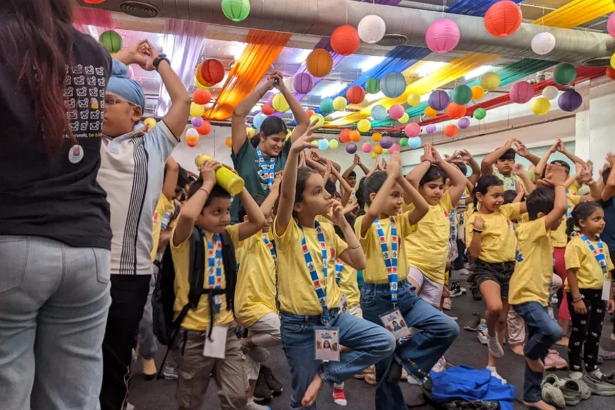 Children dancing to a Kabir doha during a K4K summer camp session at Ambience Mall Gurgaon