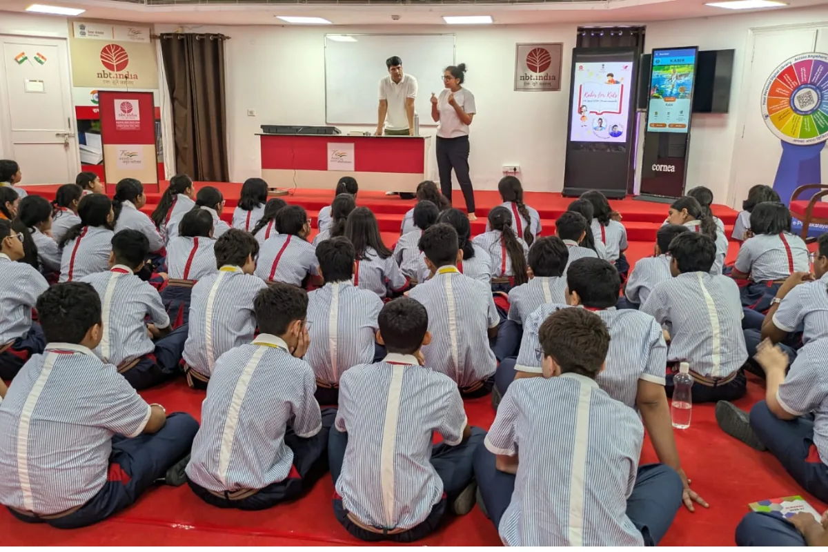 A hundred Class 9 students from GD Goenka School Noida seated in the NBT Vasant Kunj auditorium during a K4K session, April 2026